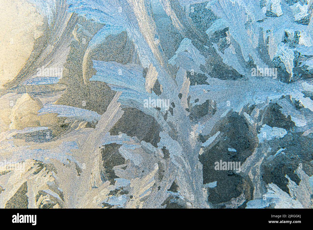 Frozen winter window with shiny ice frost pattern texture. Christmas ...