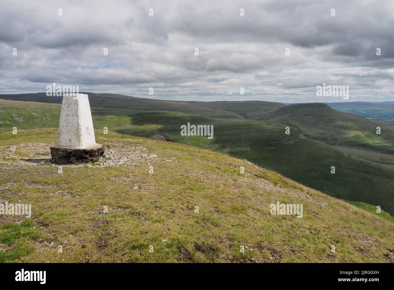 Triangulation pillar on Murton Pike looking over North Pennines, Cumbria Stock Photo