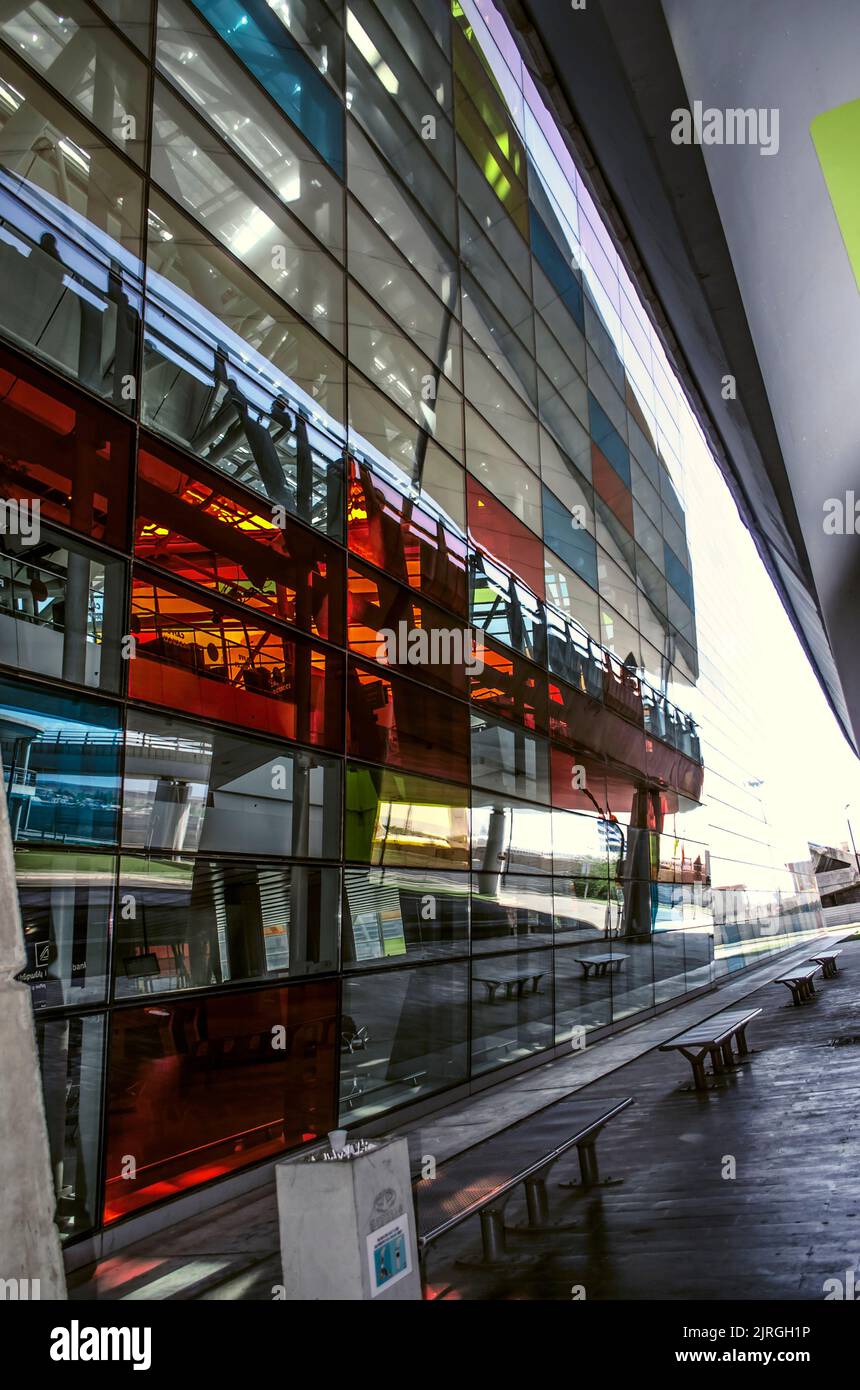Yerevan, Armenia, April 27, 2022: The original colored glass facade with the entrance to the passenger waiting and arrival hall  at Zvartnots Internat Stock Photo