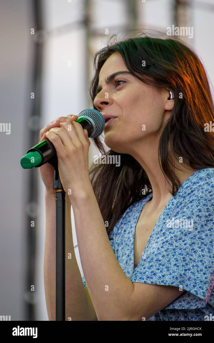 A vertical shot of valeria stoica singing at her live concert at