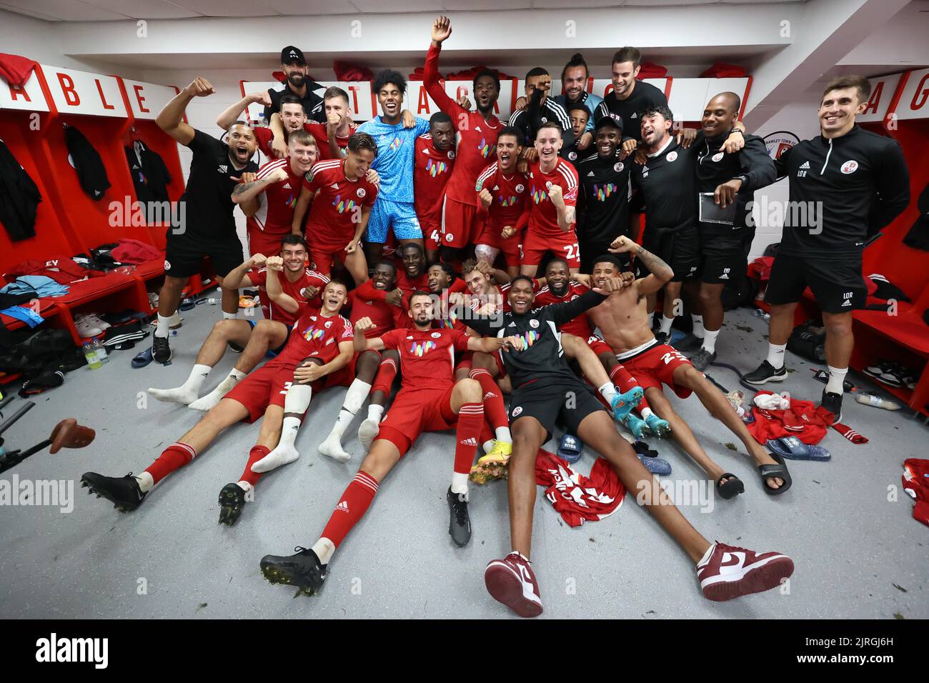Crawley players celebrate in the dressing room after beating Fulham 2-0 during the second round of the Carabao Cup between Crawley Town and Fulham at the Broadfield Stadium in Crawley. 23rd August 2022 Stock Photo