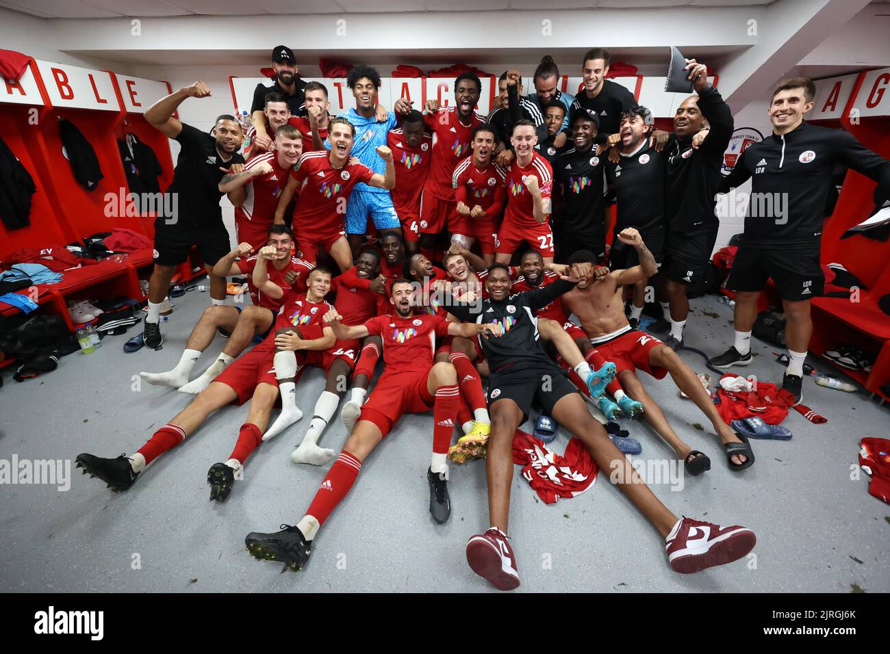 Crawley players celebrate in the dressing room after beating Fulham 2-0 during the second round of the Carabao Cup between Crawley Town and Fulham at the Broadfield Stadium in Crawley. 23rd August 2022 Stock Photo