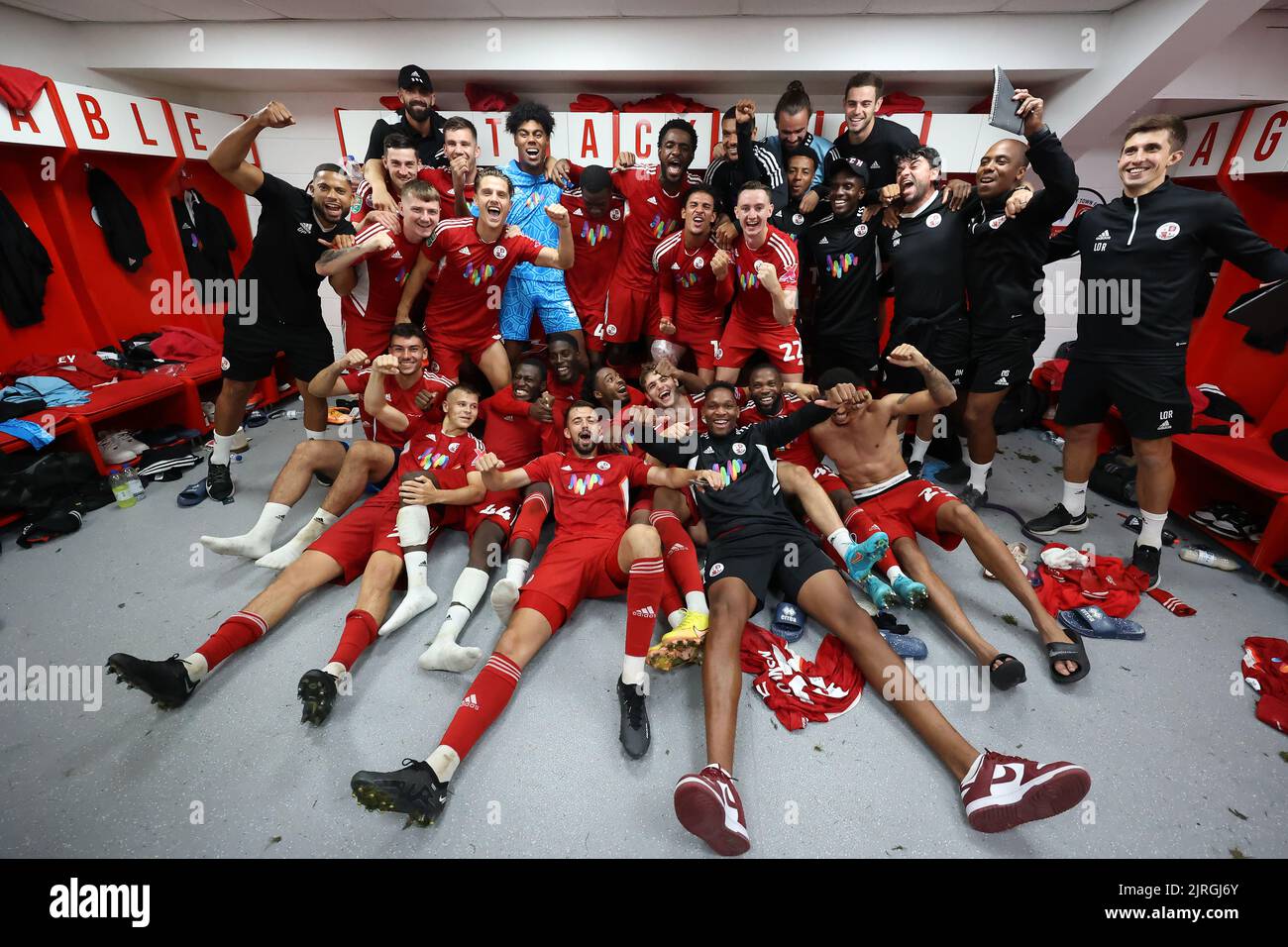 Crawley players celebrate in the dressing room after beating Fulham 20