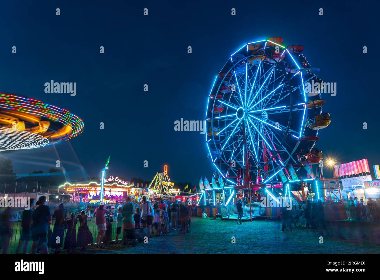 The Wonder Shows midway illuminated at night at the Harvest Festival in