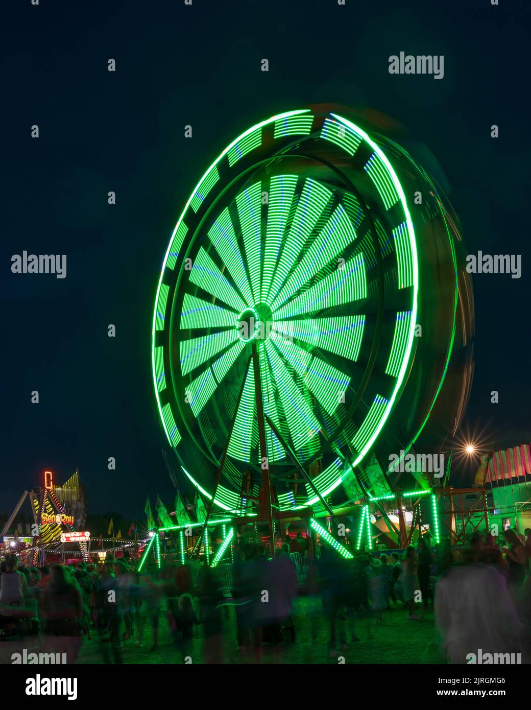 The Wonder Shows midway illuminated at night at the Harvest Festival in
