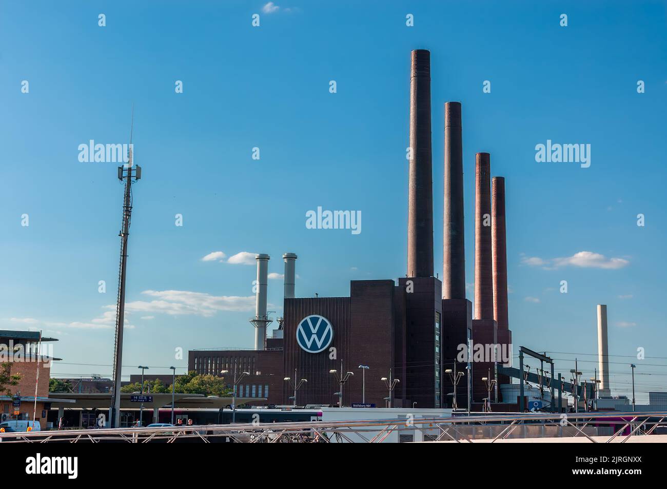 Wolfsburg, Germany - August 12, 2022: Chimneys of the Volkswagen car factory complex in Wolfsburg Stock Photo