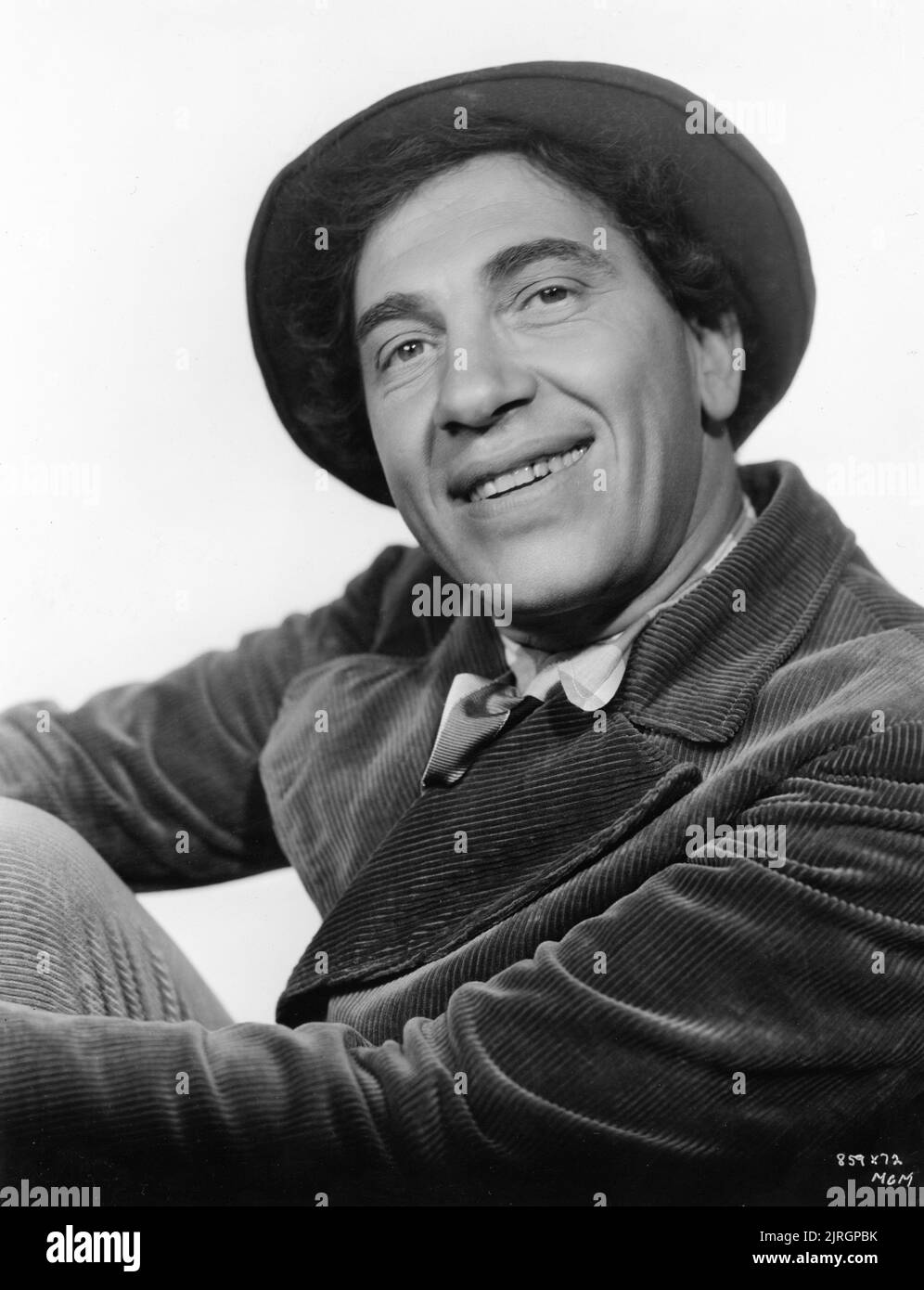 CHICO MARX Portrait by CLARENCE SINCLAIR BULL in A NIGHT AT THE OPERA 1935 director SAM WOOD writers George S. Kaufman and Morrie Ryskind producer Irving Thalberg Metro Goldwyn Mayer Stock Photo