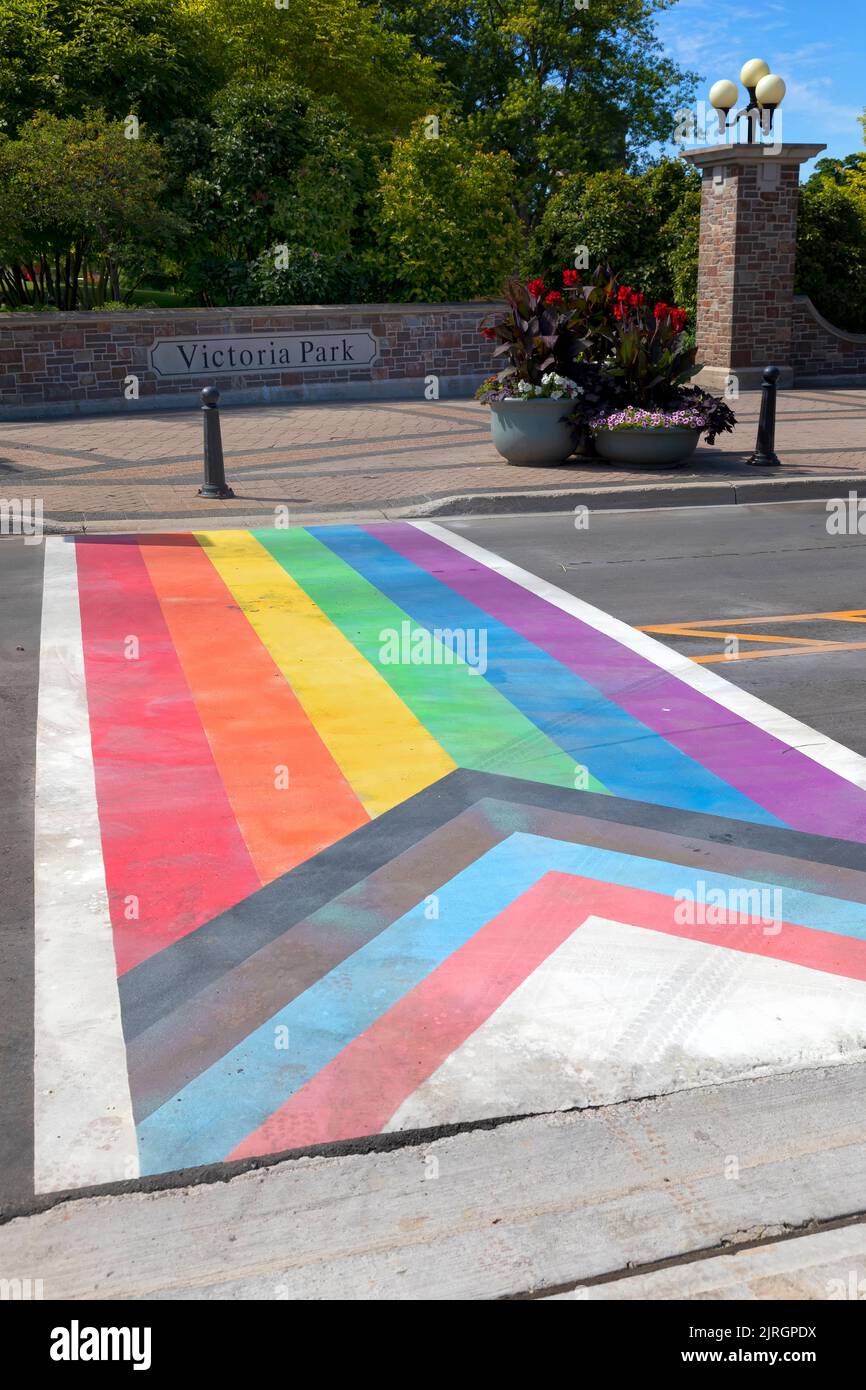 Gay-themed rainbow crosswalk entrance to Victoria Park Kitchener. Kitchener Ontario Canada. Stock Photo