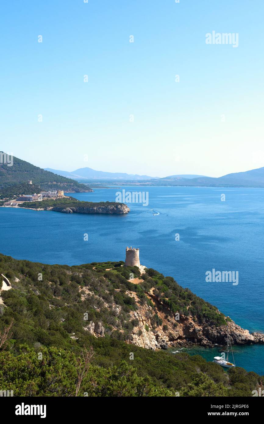 Alghero, Sassari , Italy; 3rd August 2022: Vertical view of cape Cacia, Sardinia, Italy; from top of a hill with an ancient watchtower. Sunny midday w Stock Photo