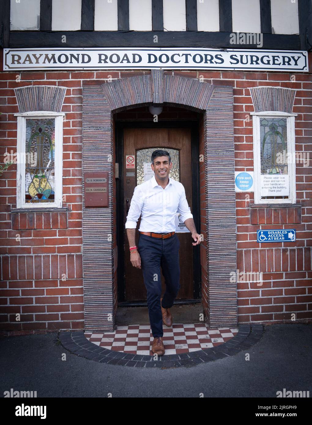 Rishi Sunak during a visit to his father's old doctors surgery where he