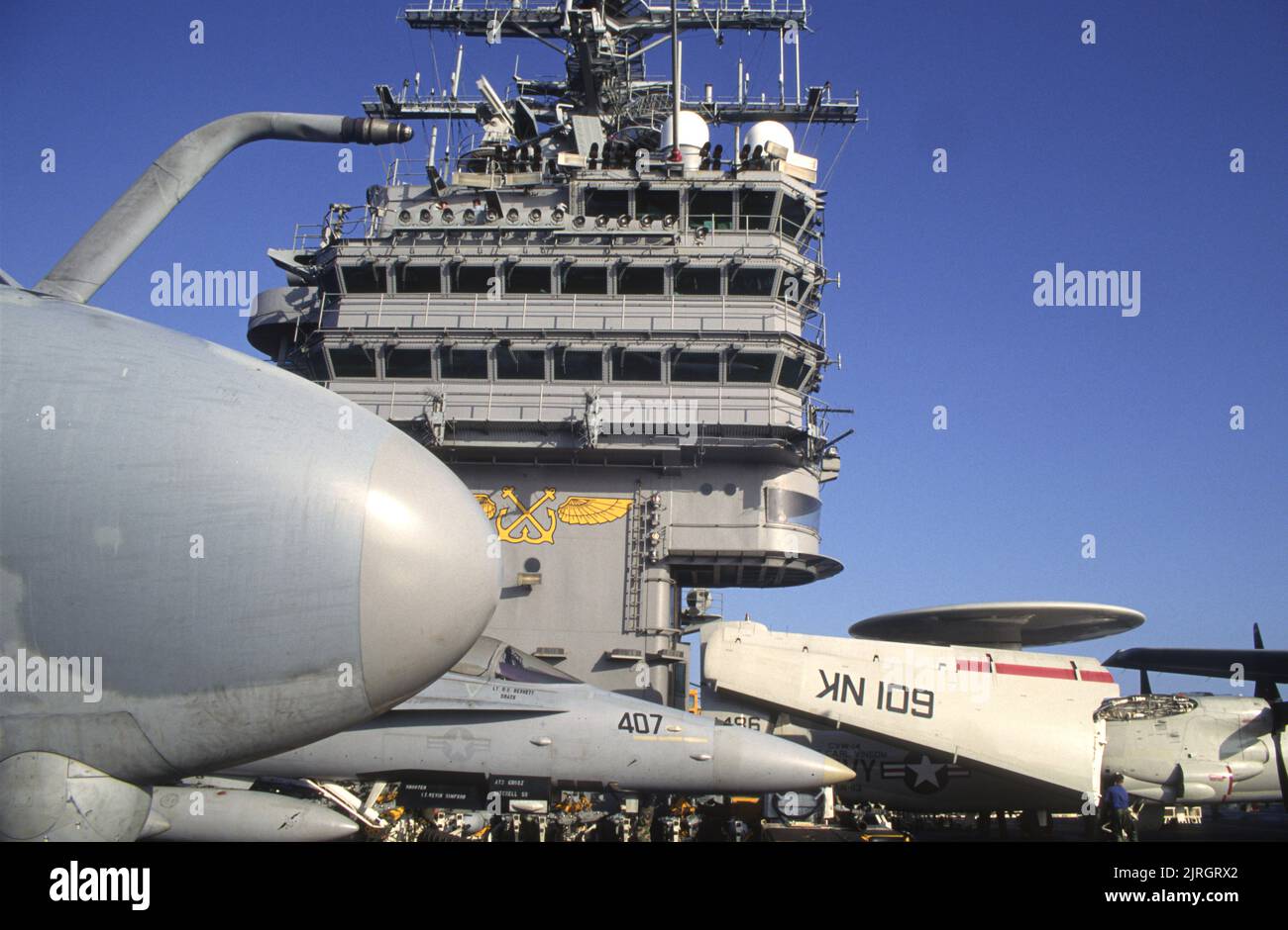 Aircraft carrier island with flightdeck full of aircraft Stock Photo