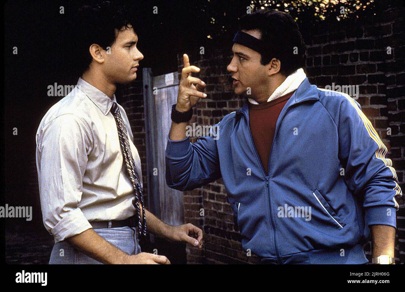 TOM HANKS, JAMES BELUSHI, THE MAN WITH ONE RED SHOE, 1985 Stock Photo