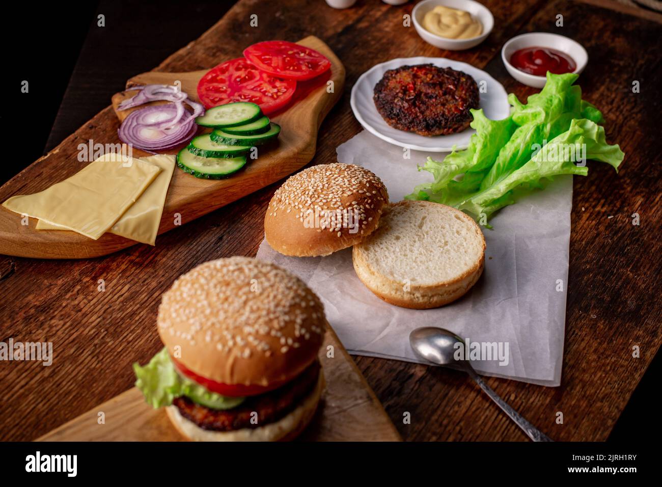 Cooking hamburger or cheeseburger. Different ingredients for a classic