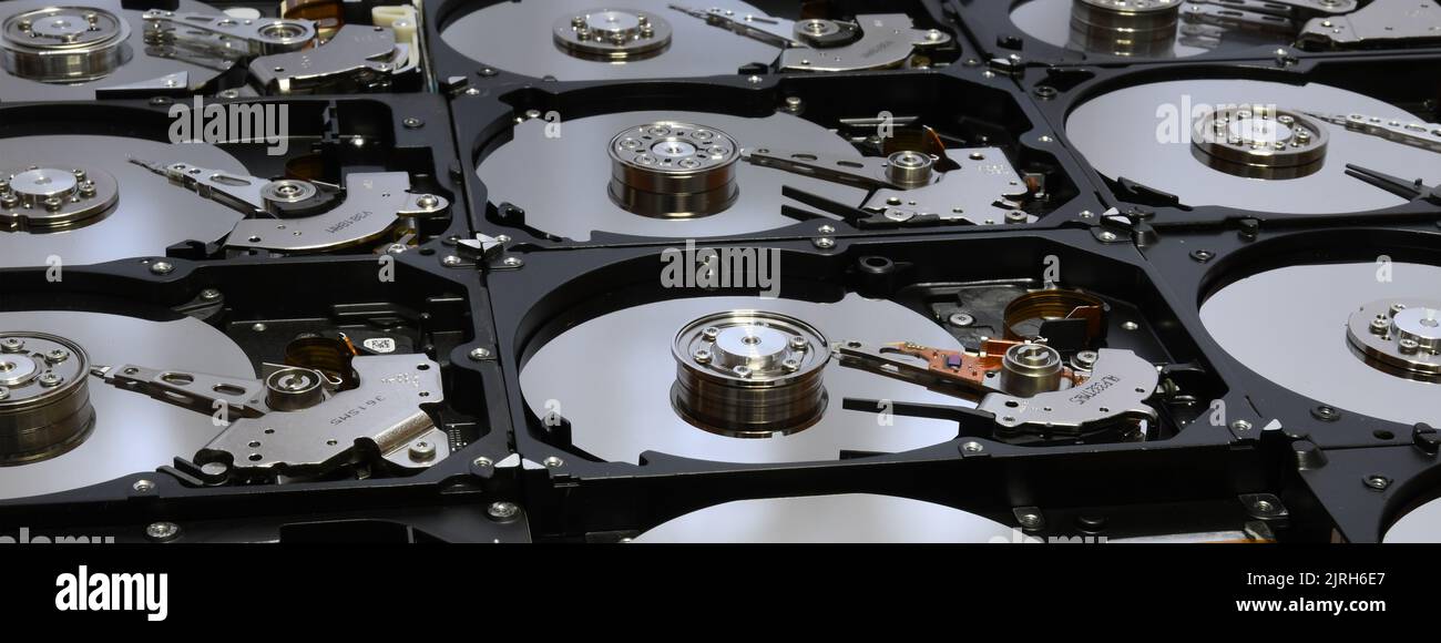 opened computer hard disk drives and aligned. long banner web image ...