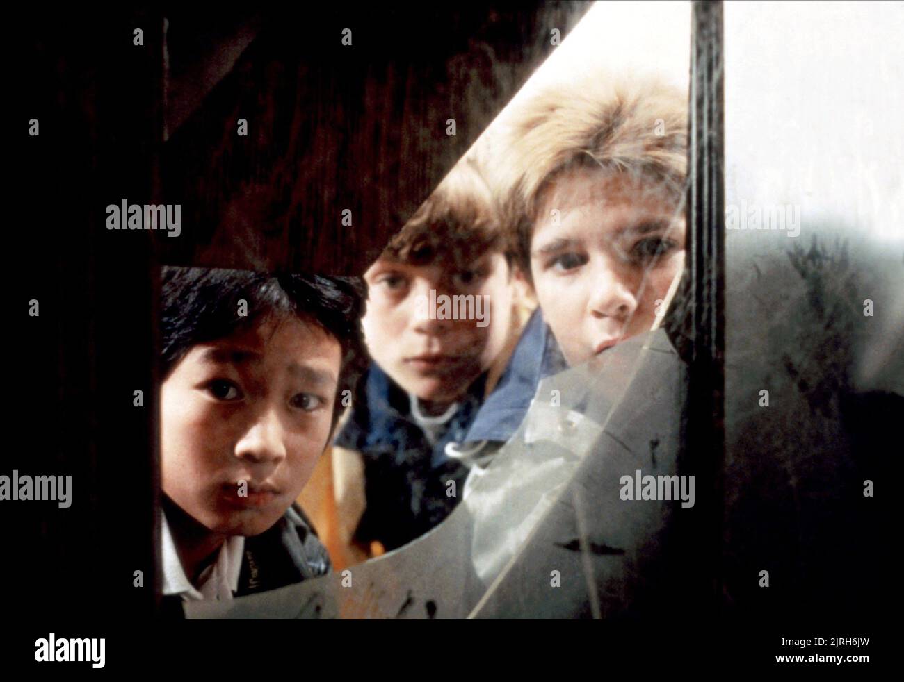 JONATHAN KE QUAN, SEAN ASTIN, COREY FELDMAN, THE GOONIES, 1985 Stock Photo