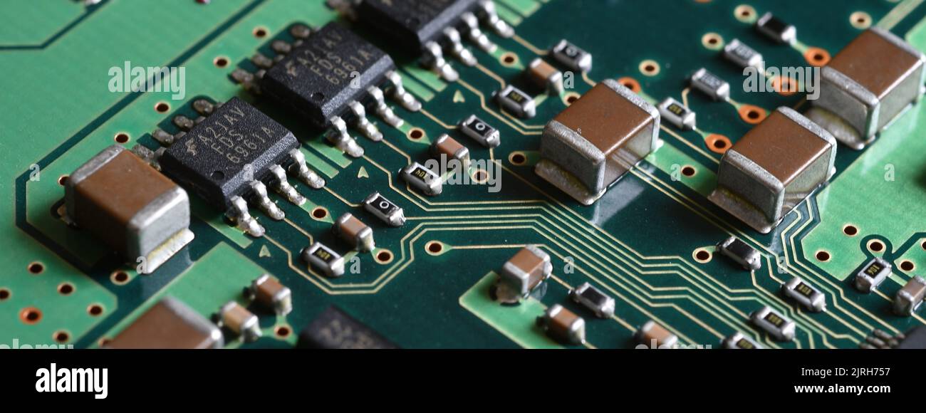 closeup on electronic circuit board with components and semiconductors