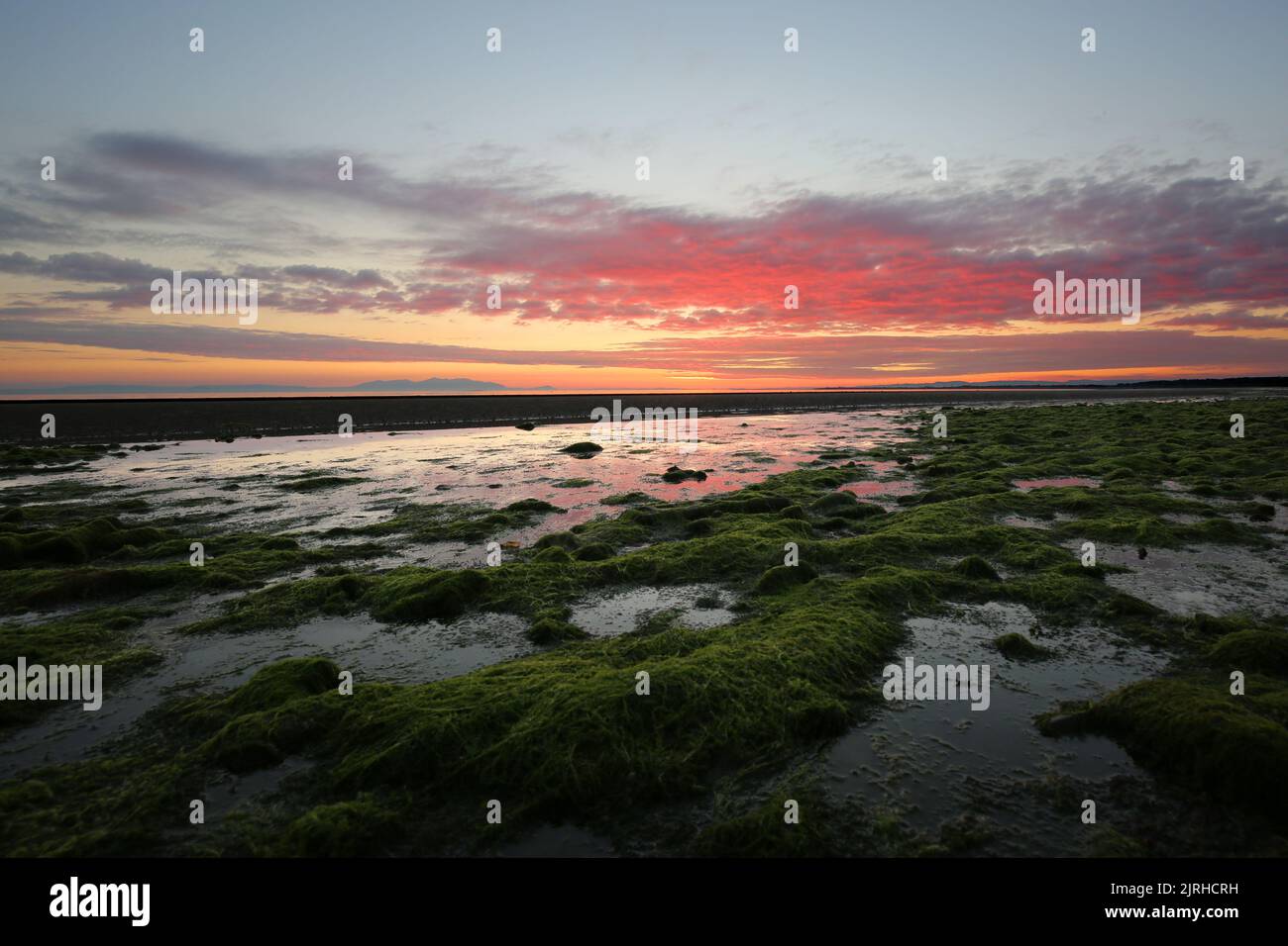 Prestwick, Ayrshire, Scotland, UK. The sun sets of the Firth of Clyde