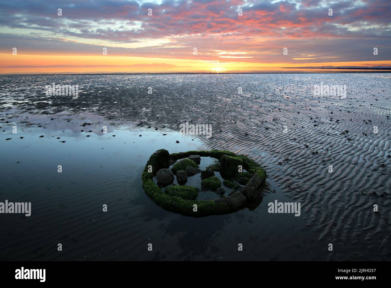 Prestwick, Ayrshire, Scotland, UK. The sun sets of the Firth of Clyde