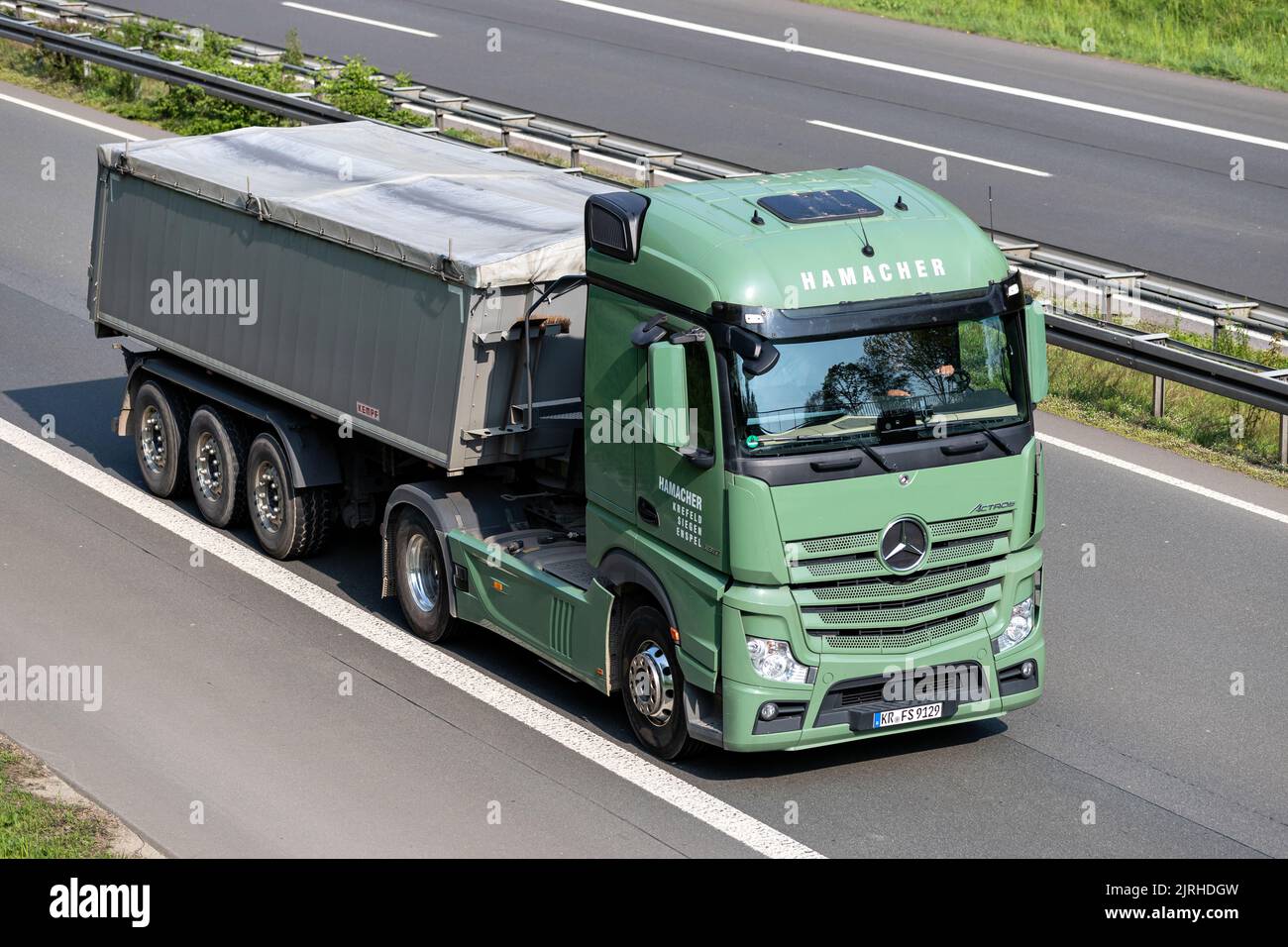 Hamacher Mercedes-Benz Actros truck with tipper trailer on motorway Stock Photo