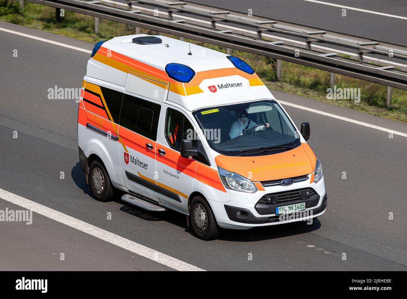 Malteser Ford Transit ambulance on motorway Stock Photo