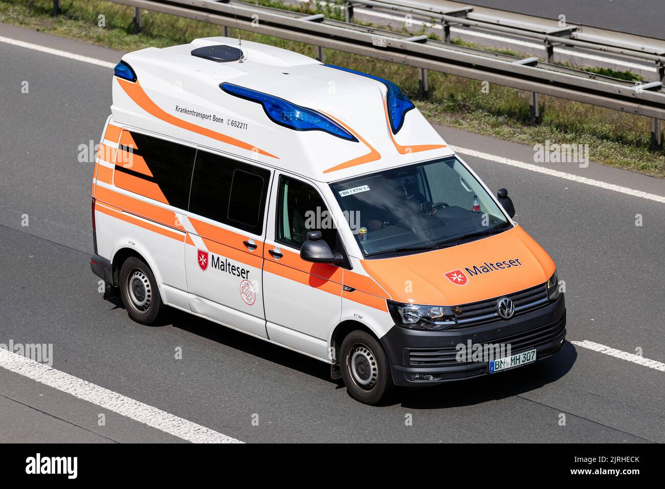 Malteser Volkswagen T6 ambulance on motorway Stock Photo