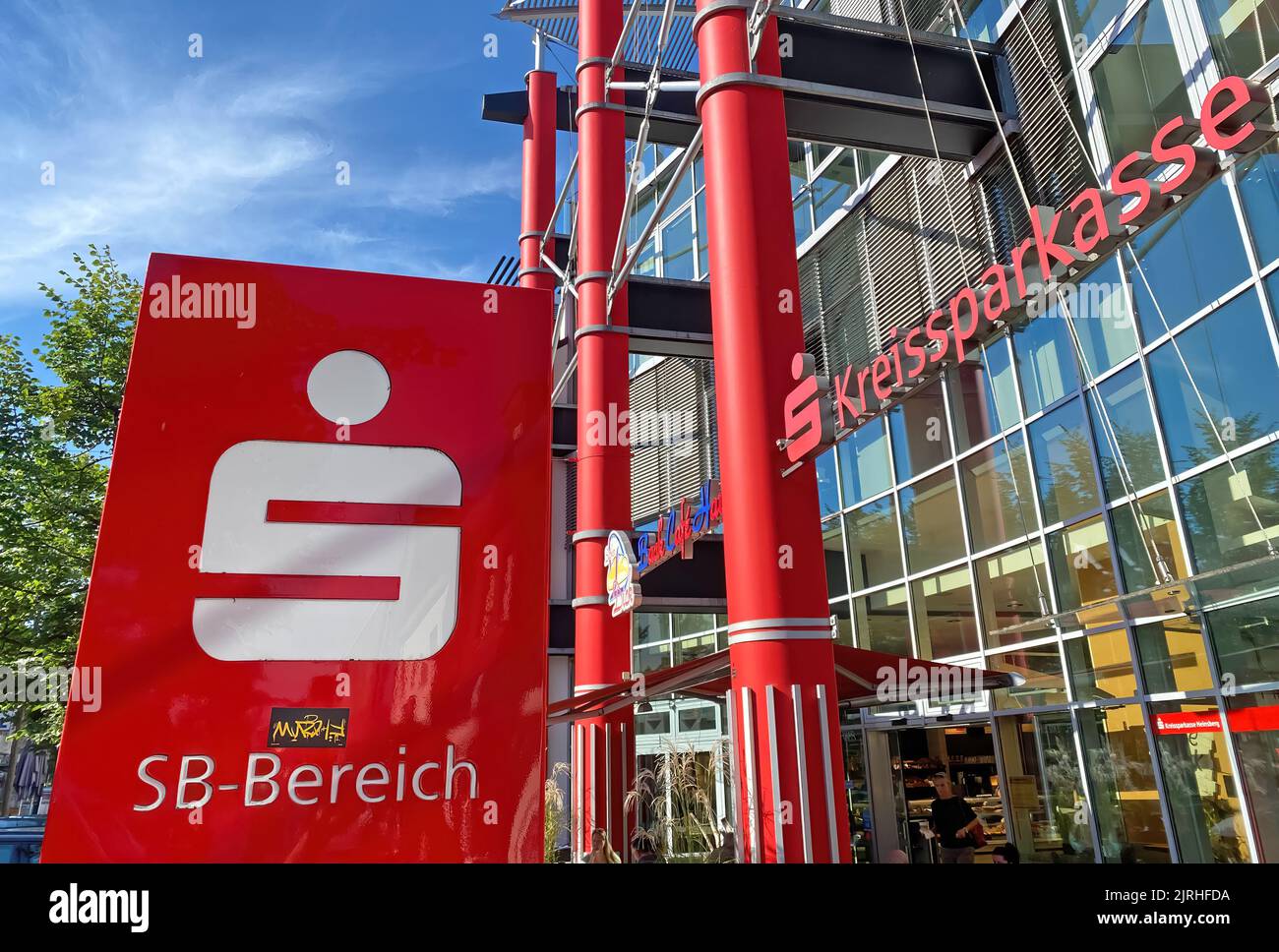 Heinsberg, Germany - 23. July 2022: Modern building of german savings bank in small rural town with logo lettering of Sparkasse Stock Photo