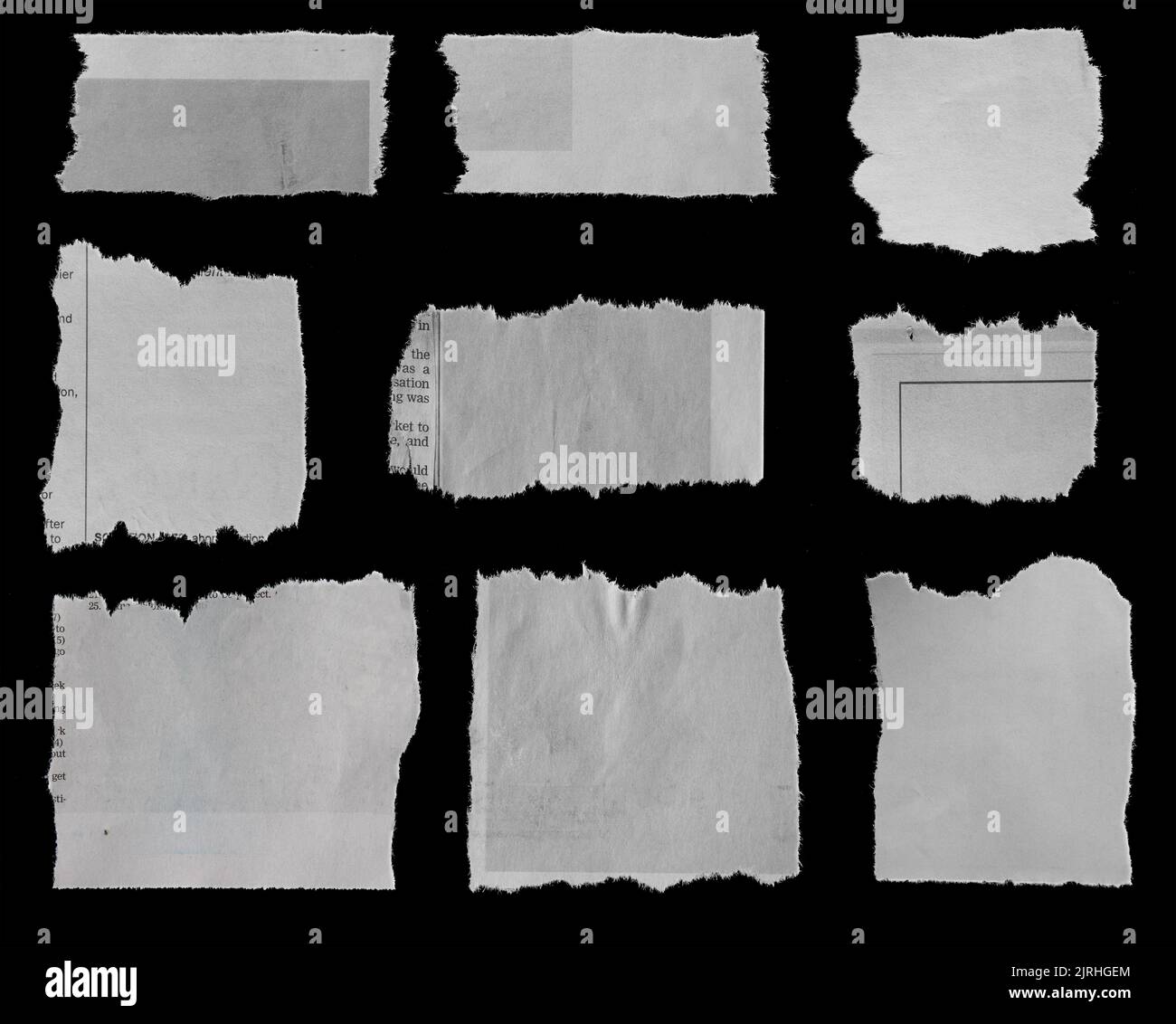 Nine pieces of torn newspaper on black background Stock Photo