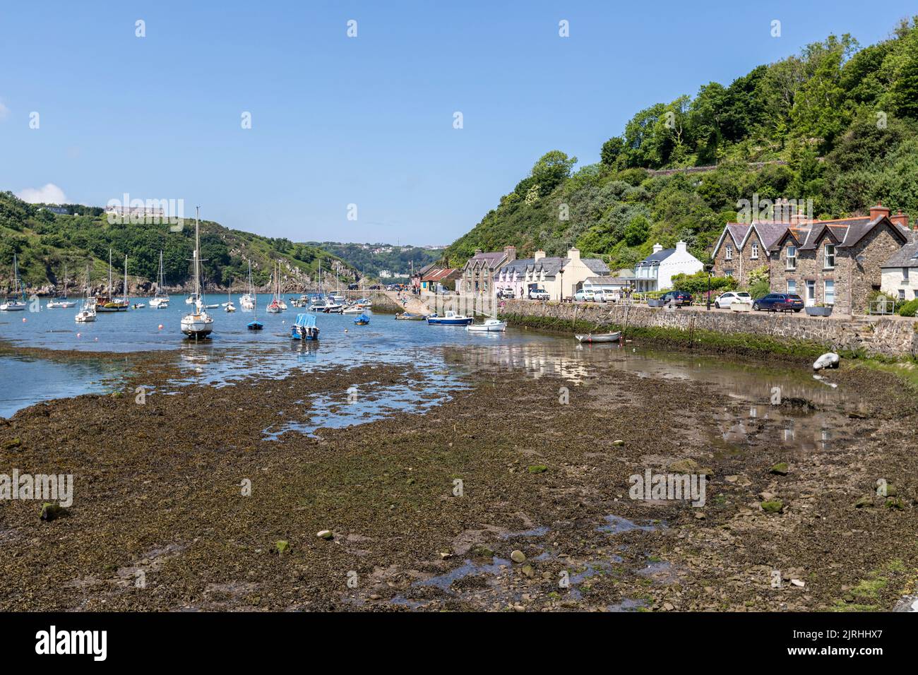 Boats in quay in village of Fishguard, Pembrokeshire, Wales, UK Stock Photo
