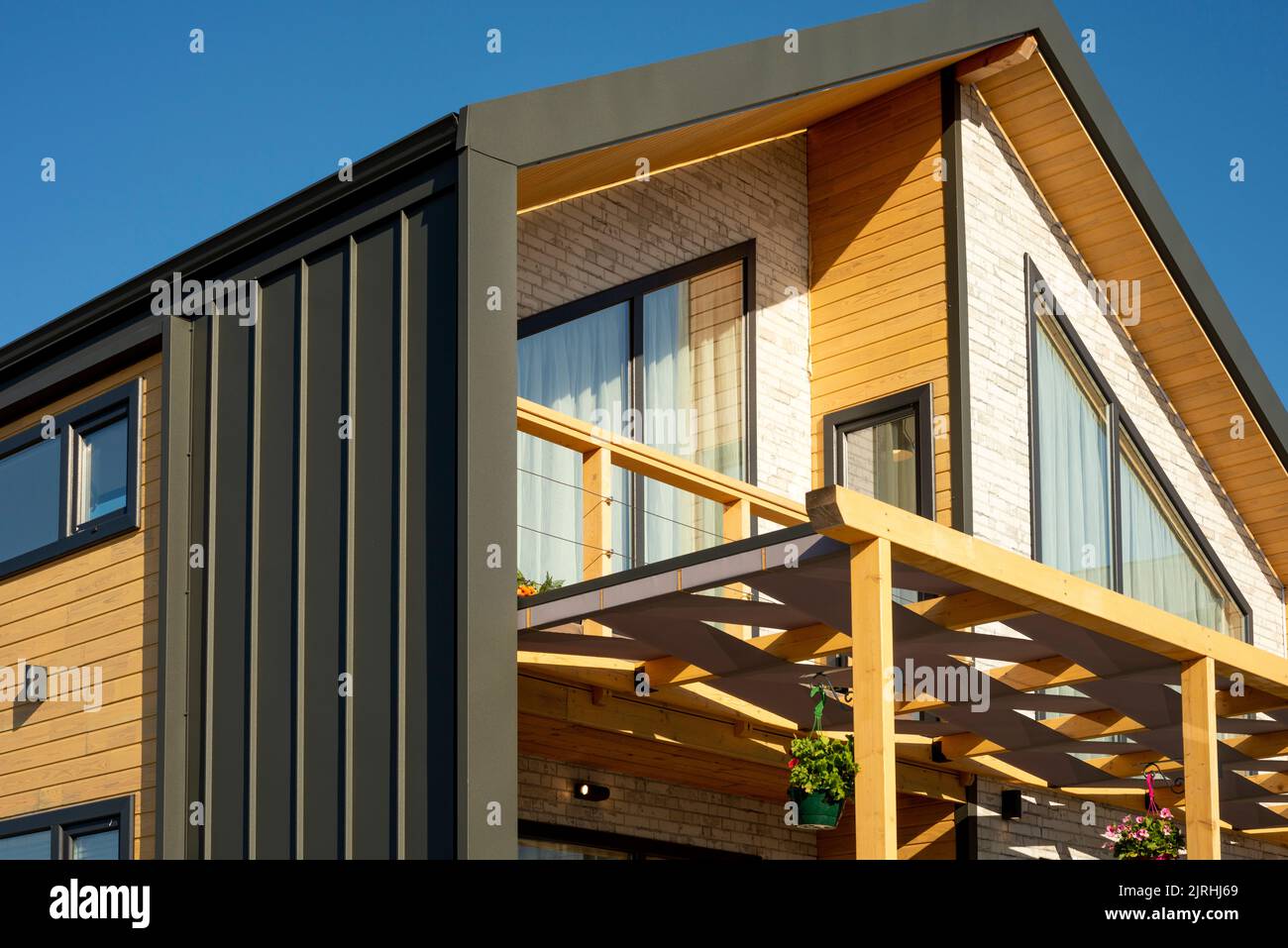 Wooden timber frame prefabricated house details as modular housing and flat pack homes concept. Stock Photo