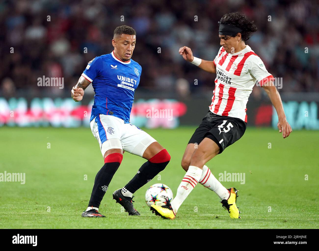 Rangers' James Tavernier (left) and PSV Eindhoven's Erick Gutierrez battle for the ball during the UEFA Champions League qualifying match at PSV Stadion, Eindhoven. Picture date: Wednesday August 24, 2022. Stock Photo