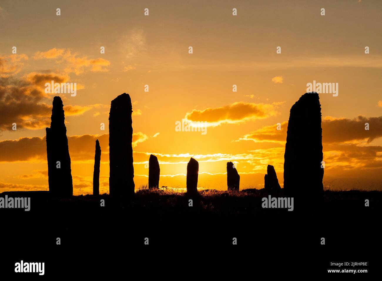 Orkney, UK. 24th Aug, 2022. The Ring of Brodgar, Orkney, looks dramatic as the sun sets. The 4,500 year old neolithic stone circle is part of the Heart of Neolithic Orkney World Heritage Site, and of the 60 original stones just 36 survive. Credit: Peter Lopeman/Alamy Live News Stock Photo