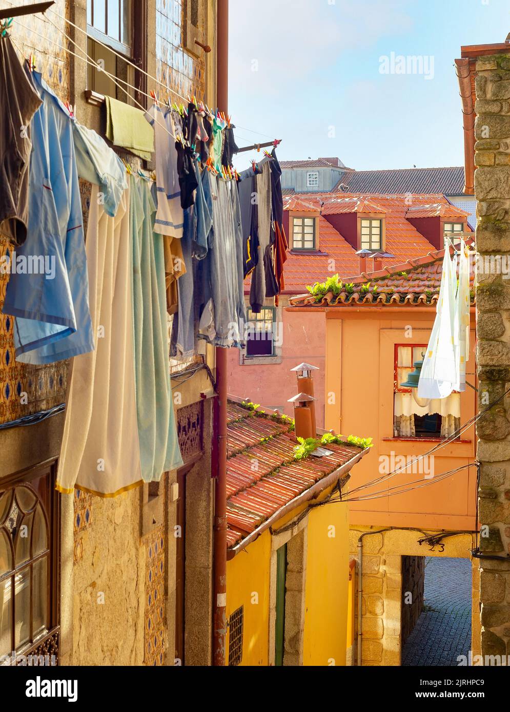Clothes drying on line, traditional old town street view, colorful houses, Porto, Portugal Stock Photo