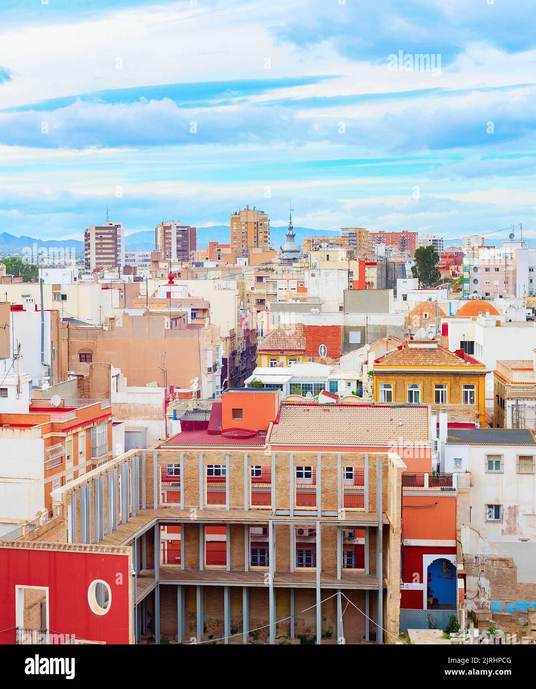 Cityscape of Cartagena, colorful houses  and mountains in backround, Spain Stock Photo