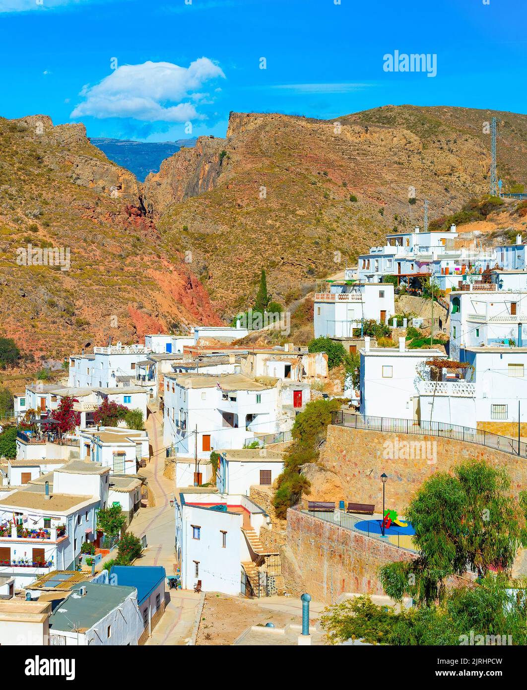 Sunny townscape of Cartagena residential area among mountains, Spain Stock Photo