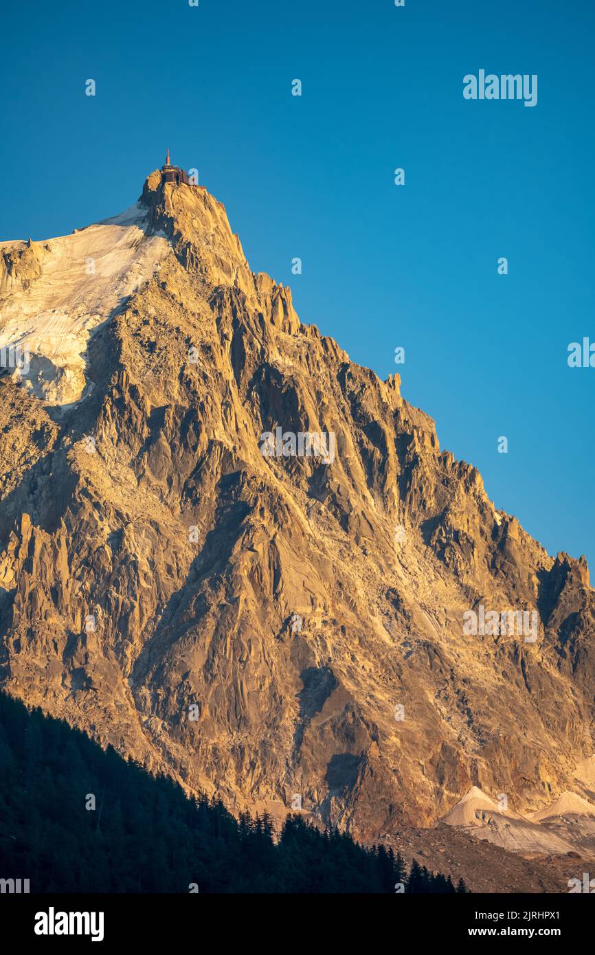 The panorama of Les Aiguilles towers in sunset light Grands Charmoz