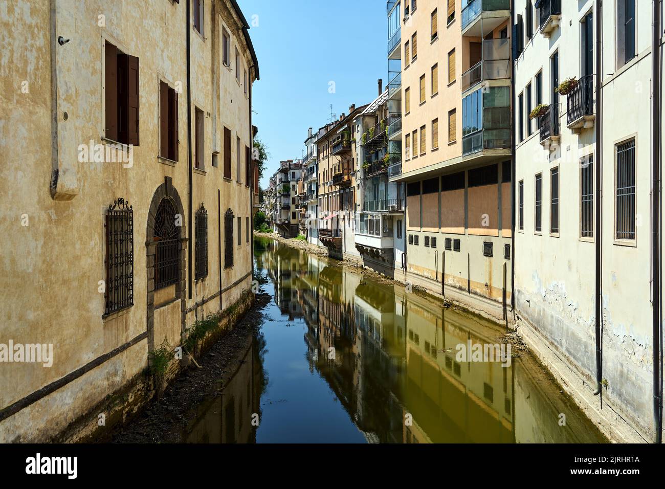 Residential buildings with balconies on the canal in the city of Padua
