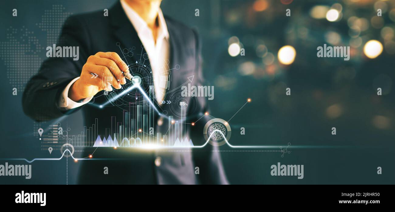 Businessman drawing growth graph chart sales and data economic on global structure networking connection. Stock Photo