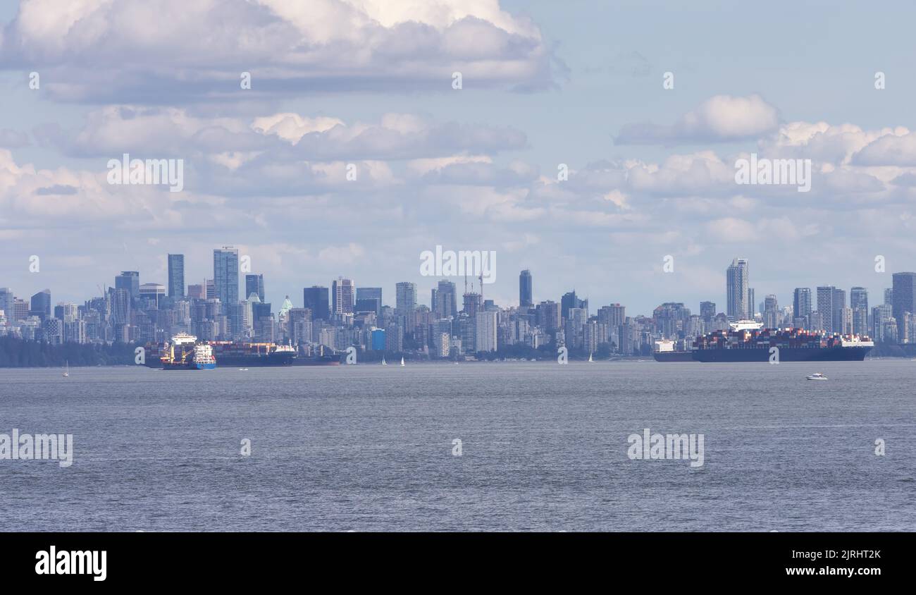 Downtown City Skyline with Industrial Cargo Ships Stock Photo - Alamy