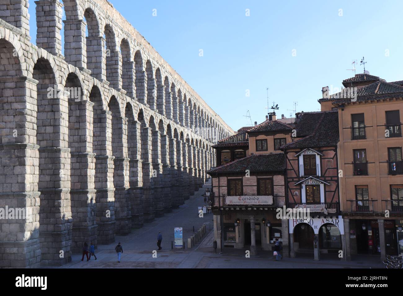 Aqueduct of Segovia, next to Madrid in Spain with the most famous restaurant in the old town with mix of cultures. Historical and Touristic city Stock Photo