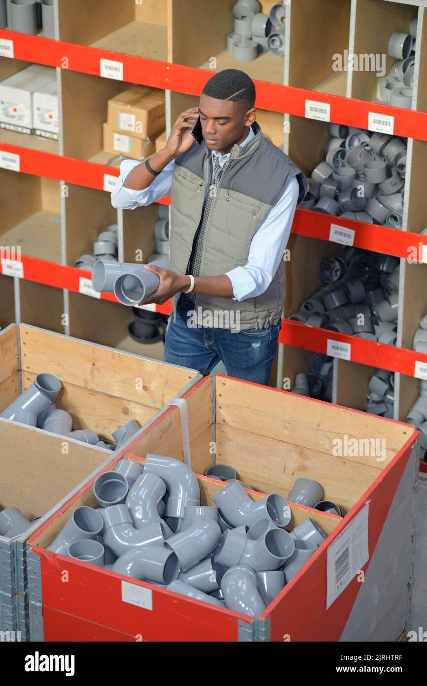 a plumbing supply order worker Stock Photo Alamy
