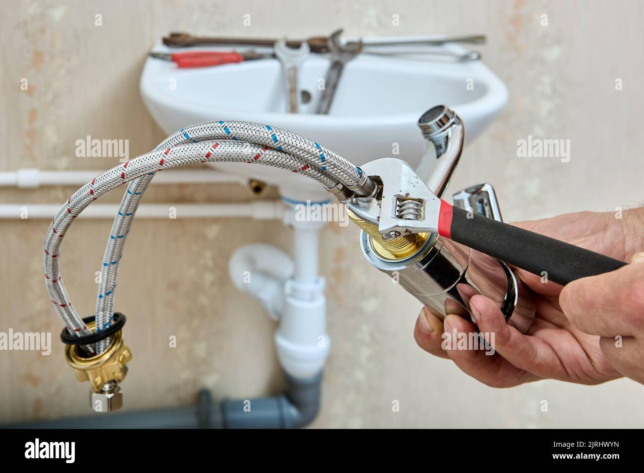 Installing bathroom sink fixture hires stock photography and images