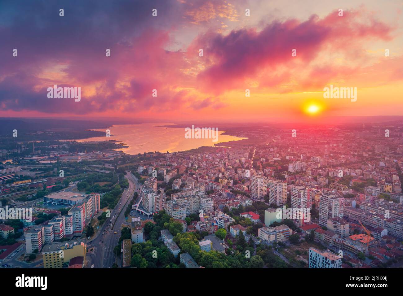 Dramatic sunset over Varna city and Varna lake Stock Photo