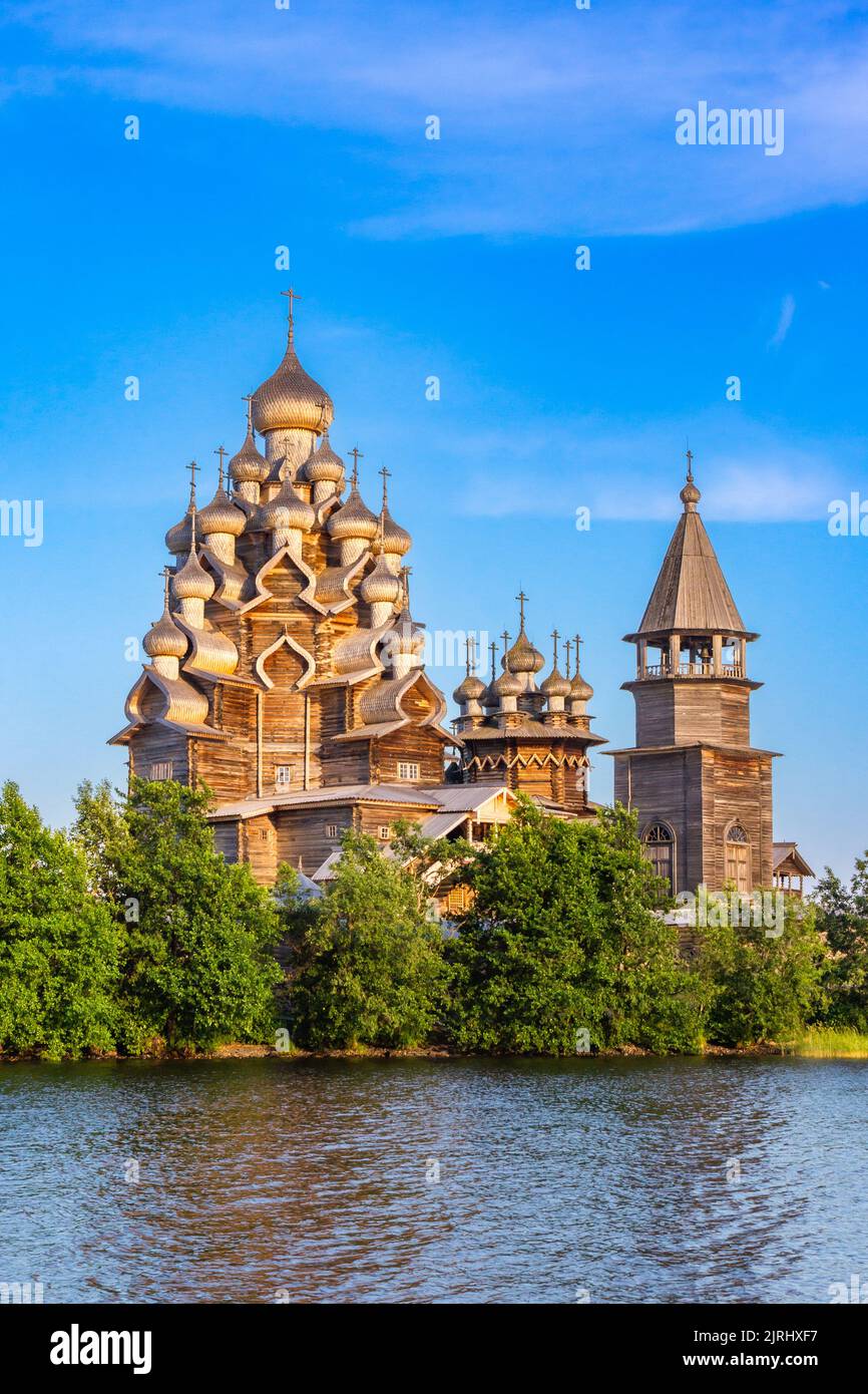 View to old monastery Kizhi Pogost, wooden Temple and Churchyard. Church of Transfiguration, bell tower in summer at sunset. Natural ecological clean Stock Photo