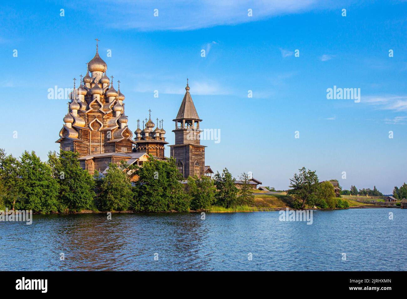 View to old monastery Kizhi Pogost, wooden Temple and Churchyard. Church of Transfiguration, bell tower in summer at sunset. Natural ecological clean Stock Photo