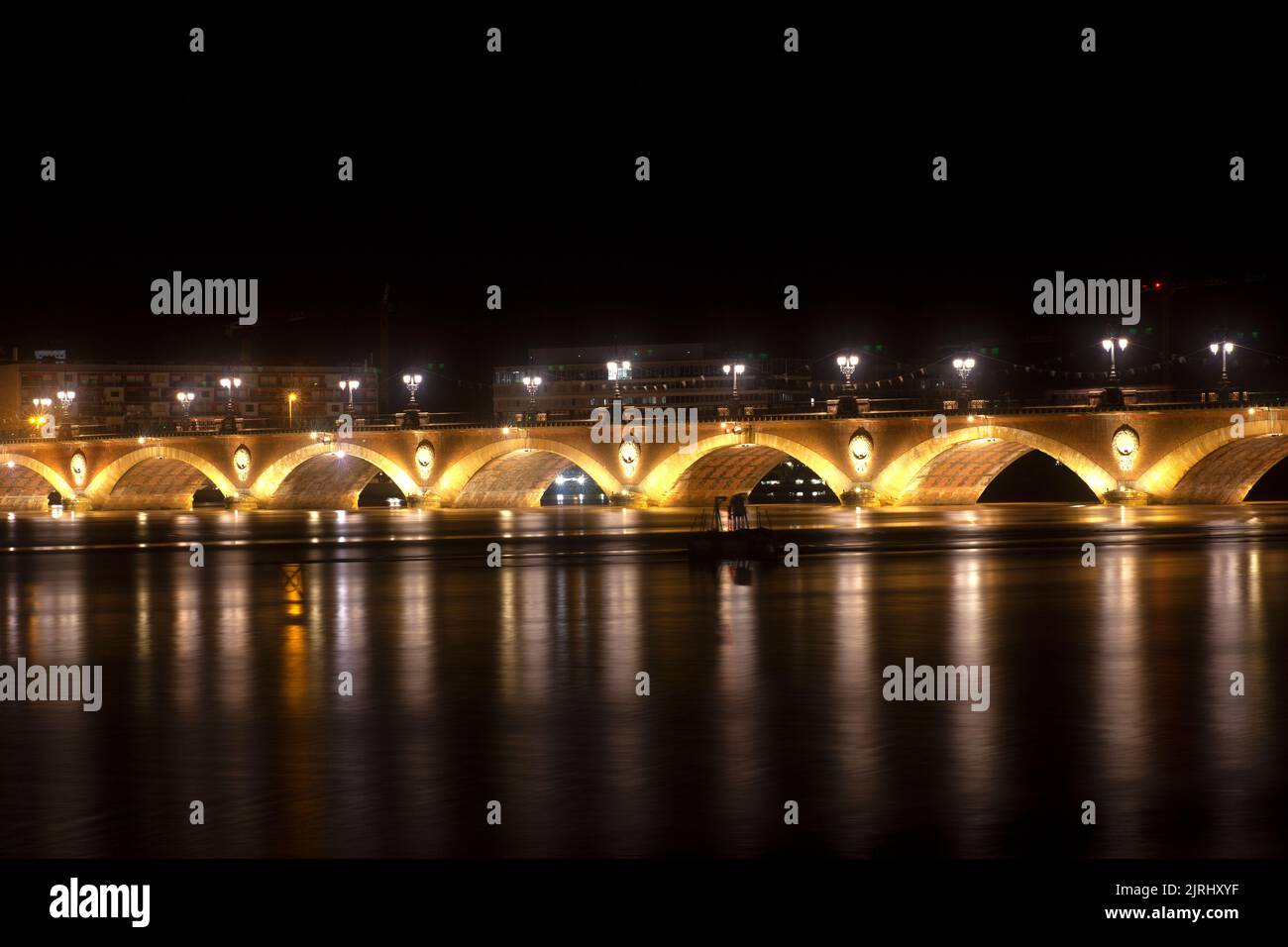 Night view of the famous bridge of Bordeaux called Le Pont de Pierre