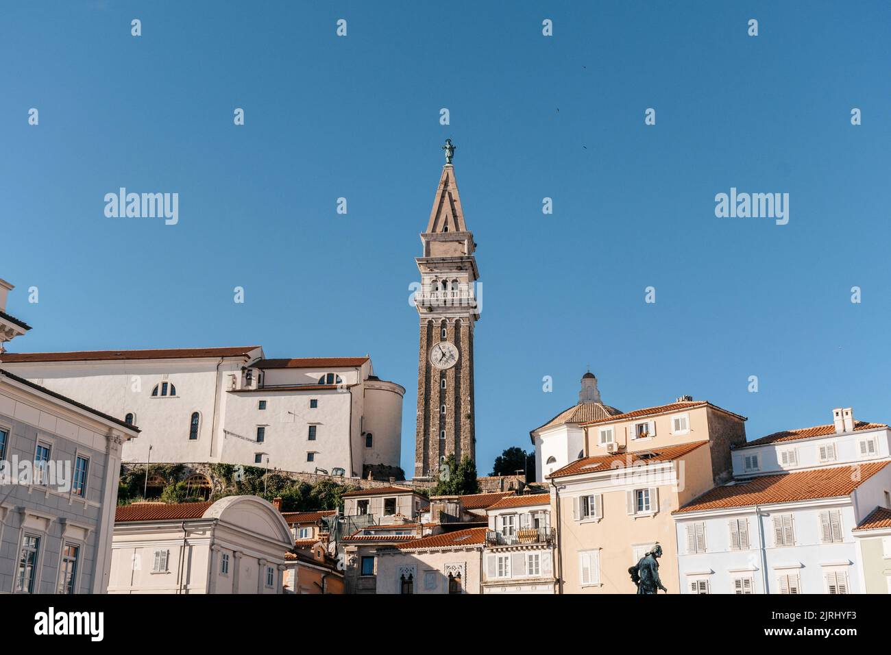 The buildings and church bell tower seen from the Tartini Square in ...
