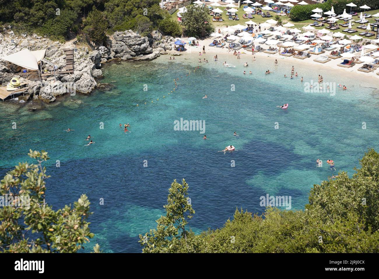 Sivota, Epirus, Greece. Mikri Ammos Beach Crowded With Tourists Stock Photo