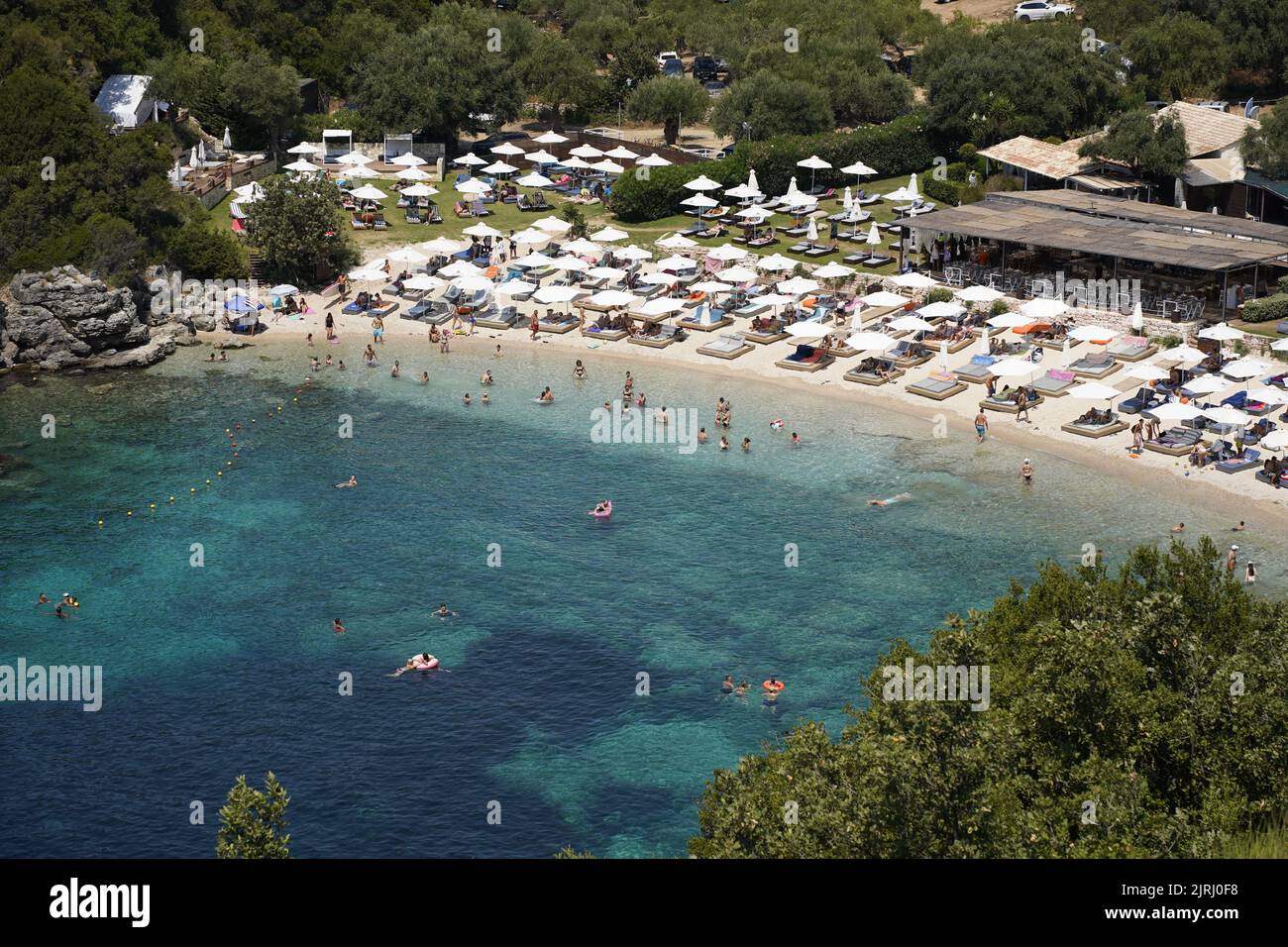 Sivota, Epirus, Greece. Mikri Ammos Beach Crowded With Tourists Stock Photo