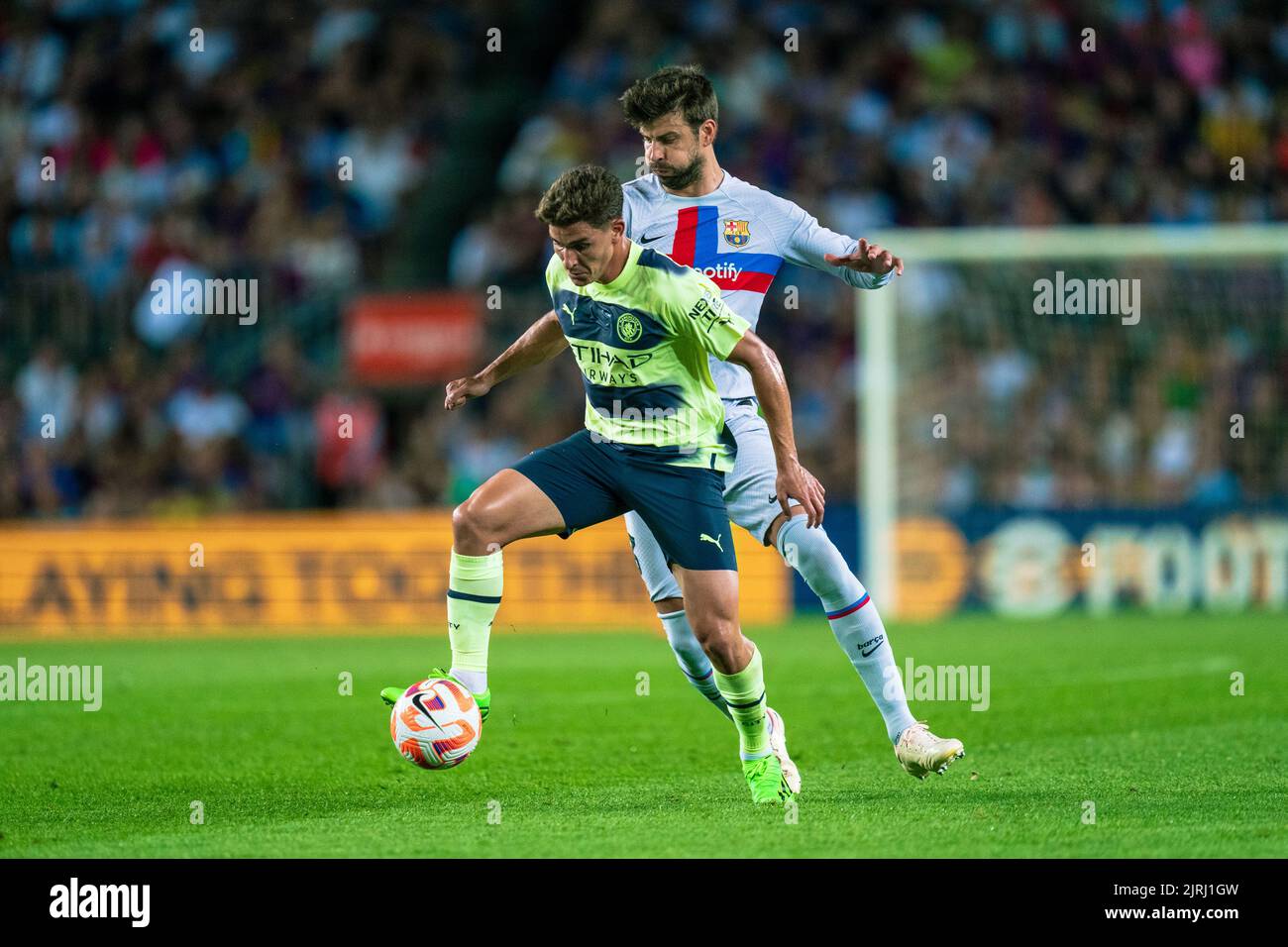 Barcelona, Spain, 24, August, 2022.  Spain-Football- Friendly match for the benefit of ALS research between FC Barcelona v Manchester City. (19) Julian Alvarez and (3) Gerard Piqué.  Credit: JG/Alamy Live News Stock Photo