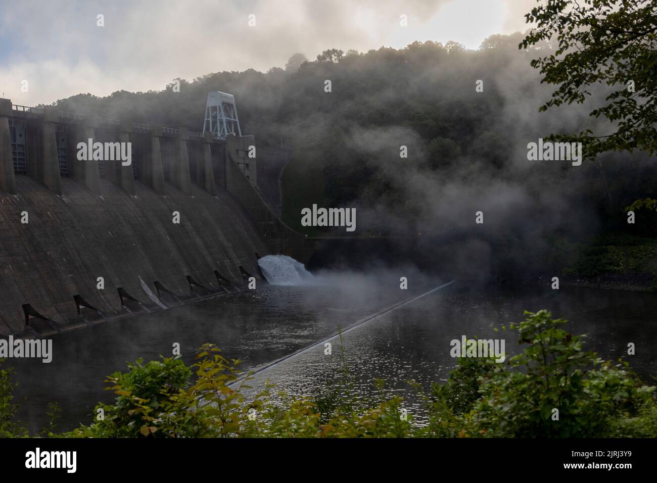 Fog lifts in morning downstream from the Conemaugh River Lake in Saltsburg, Pennsylvania, Aug. 13, 2022. The U.S. Army Corps of Engineers Pittsburgh District operates the reservoir to provide flood risk reduction to the Conemaugh, Kiskiminetas, lower Allegheny and upper Ohio River valleys. Recreationally, Conemaugh River Lake provides residents and visitors with biking and hiking trails, fishing and picnic areas. Stock Photo